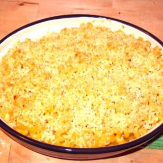 Baked Macaroni and cheese in a blue and white baking casserole.