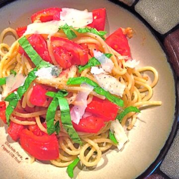 Tomato-Basil Pasta serving in a bowl. A healthy meal that makes your garden (or Farmer's Market) tomatoes shine! #pasta #healthyfood #tomatobasilpasta #healthyeating #quickmeal @FlippedOutFood