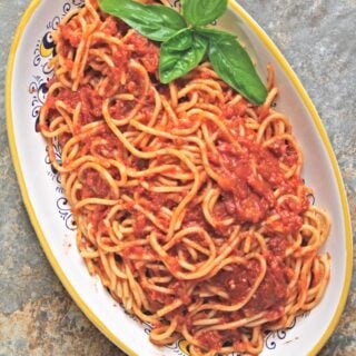 Slow-roasted tomato sauce: served with spaghetti. #italianfood #marinarasauce #gardentomatosauce #tomatosauce #flippedoutfood #pastasauce via @FlippedOutFood