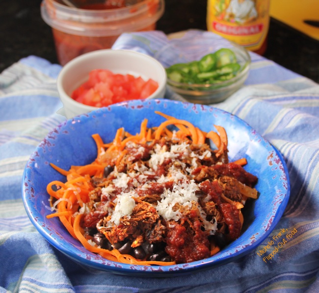 enchilada bowls with sweet potato noodles and fixings in the background