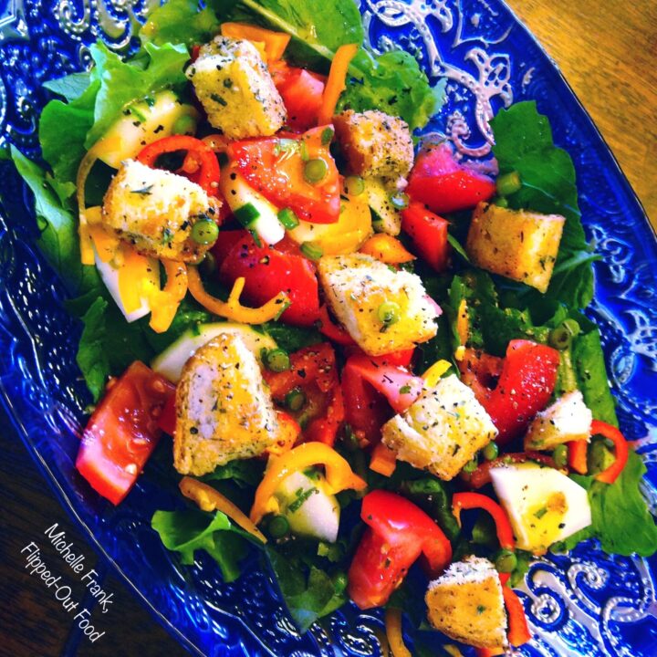 garlic scape vinaigrette on a salad of lettuce, tomatoes, sliced sweet peppers, and homemade croutons. #saladdressing #vinaigrette #garlicscapes #healthyeating @FlippedOutFood