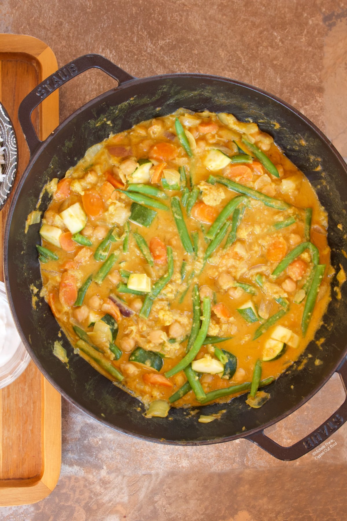 Easy Red Vegetable Curry in a cast-iron wok.