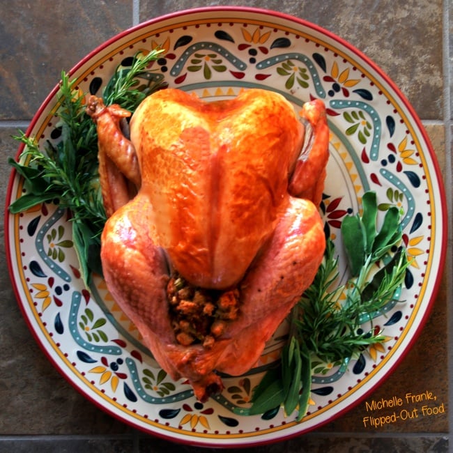 ultimate classic roast turkey on a platter with herbs