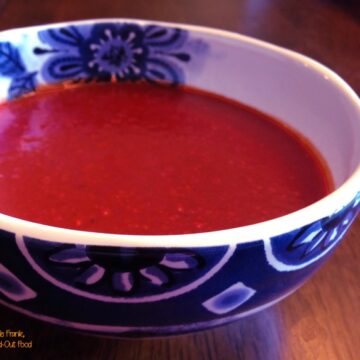 red enchilada sauce in a blue and white bowl