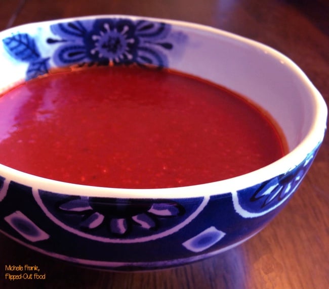 red enchilada sauce in a blue and white bowl