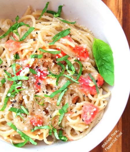 easy garlic-tomato-basil pasta serving closeup showing basil chiffonade
