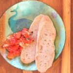 Roast Garlic-Sweet-Pepper Bruschetta on decorative plate, top view