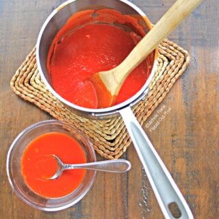 Easy Homemade Pizza Sauce in saucepan and a serving dish. Put the sauce on your homemade or store-bought pizza dough, French bread, naan, or pita bread with mozzarella and your favorite toppings for a fun, kid-friendly meal!