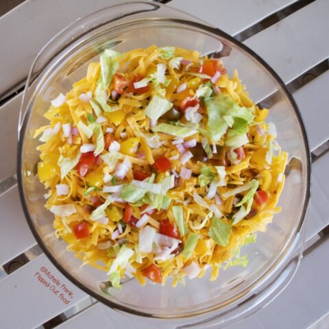 Taco Dip (Phil's Phamous) in a pyrex serving container.