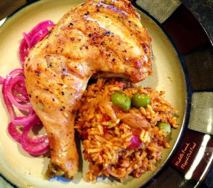 Easy One-Pot Meal Recipes: One-Pan Arroz con Pollo: a whole leg served with the rice pilaf and pickled onion garnish.