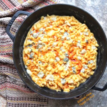 One-Pot Buffalo Chicken Macaroni and Cheese: top view showing a cast-iron skillet full of the Buffalo chicken macaroni and cheese.