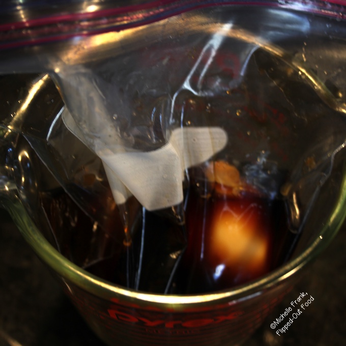 Ramen egg marinade: soy sauce, miso, and rice vinegar in a Ziploc bag set into a measuring cup.