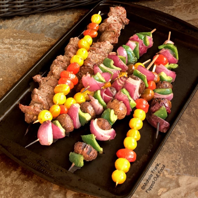 Marinated Vegetable Beef Kebabs on a baking sheet.