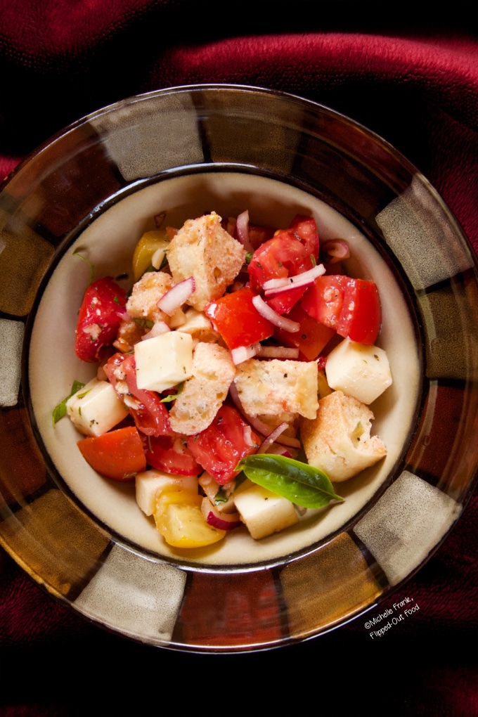 Overhead view of a serving of panzanella salad. 