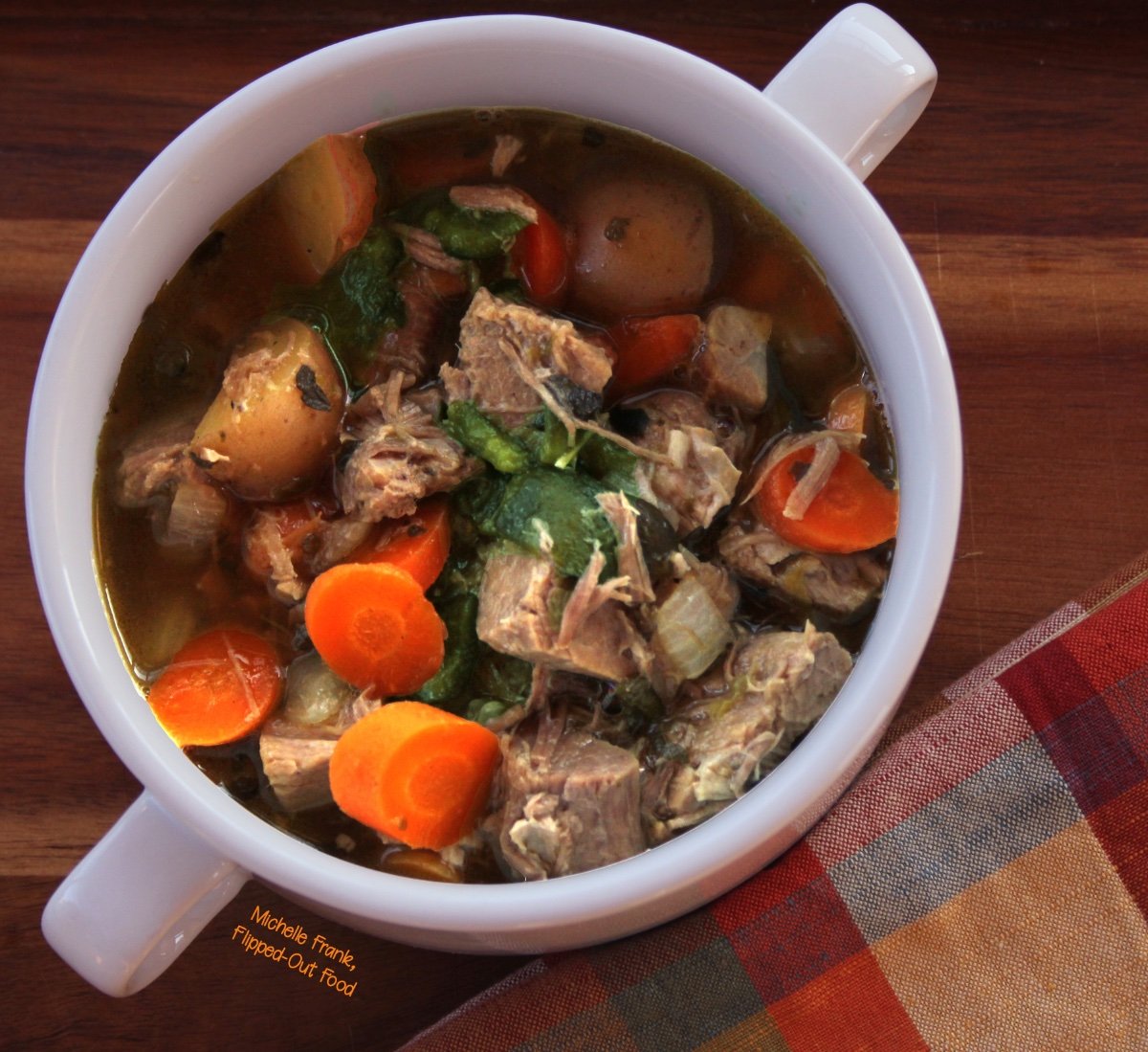 Caldillo: Green Chile Pork Stew in a 2-handled bowl.