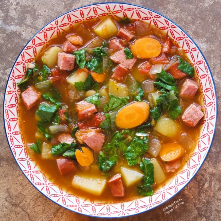Easy Soups for Fall: Sausage Kale and Potato Soup in a red and white bowl.