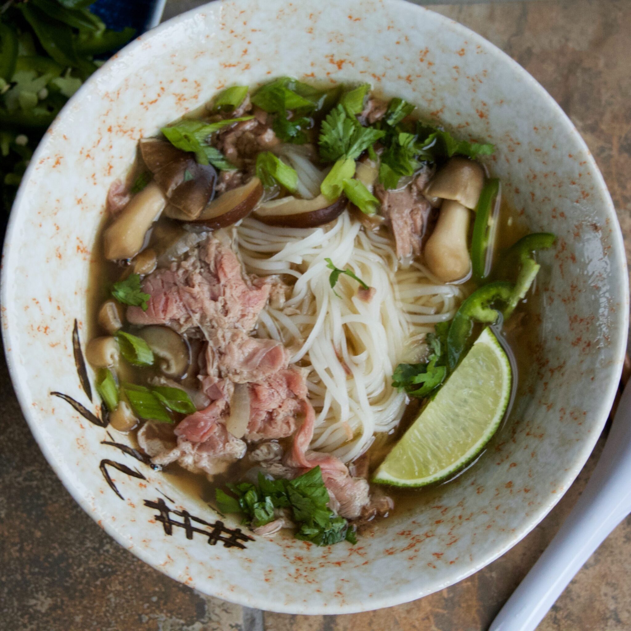 A bowl of Real Deal Beef Pho Noodle Soup.