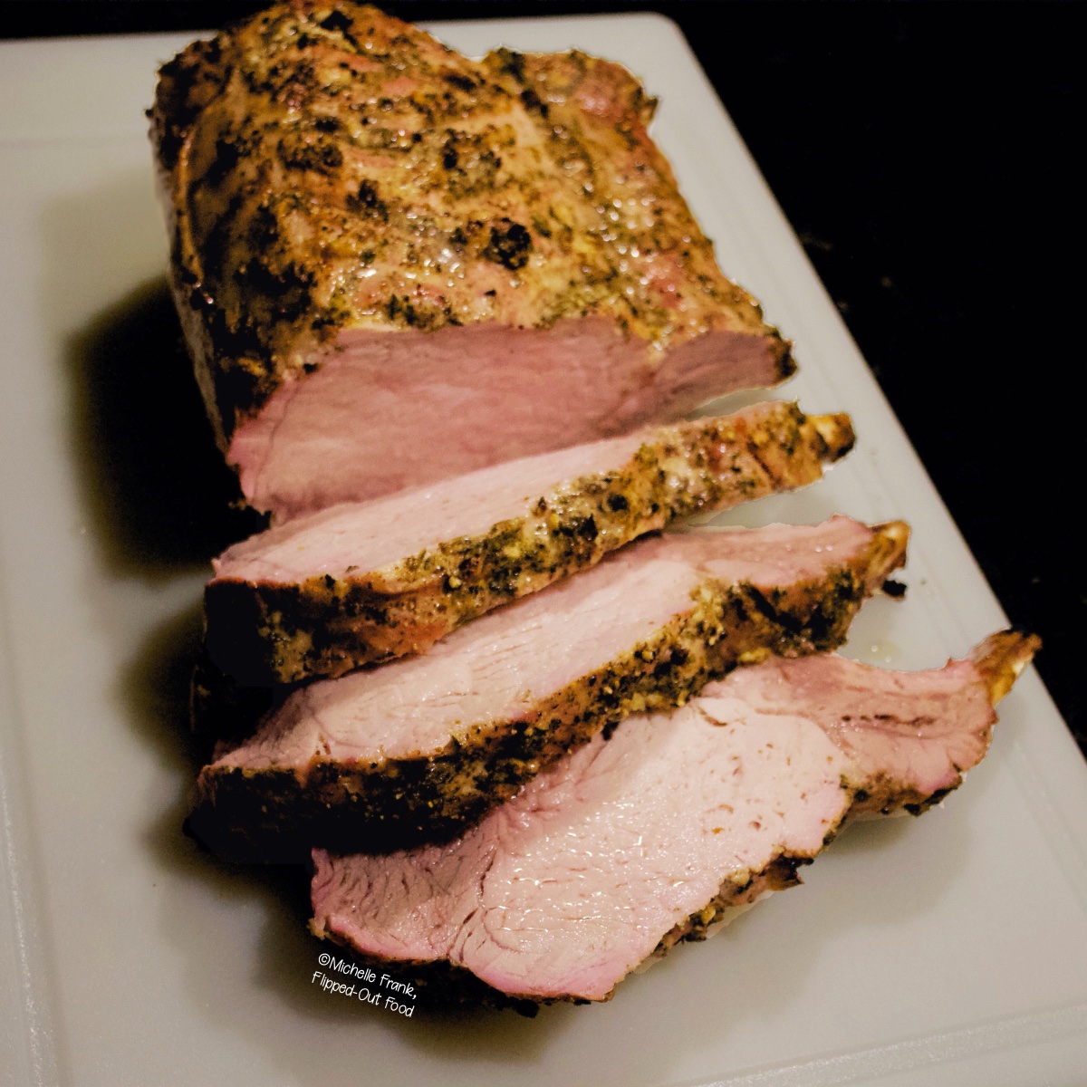 Herb-Roasted Rack of Pork, a small Thanksgiving dinner idea.