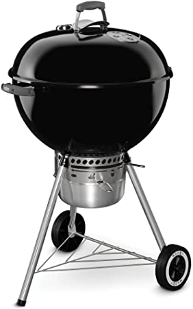 A smoker or charcoal grill set up for smoking