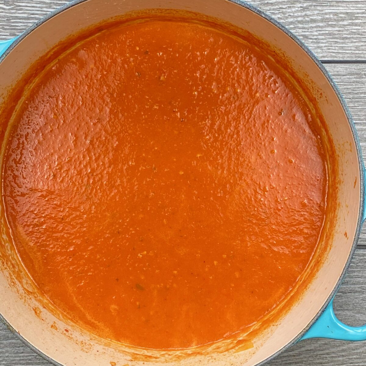 Top view of fresh tomato soup after it has been thoroughly blended.