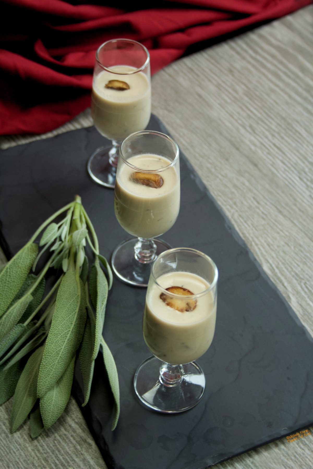 Soup shots of homemade Cream of Mushroom Soup arranged on a slate platter.