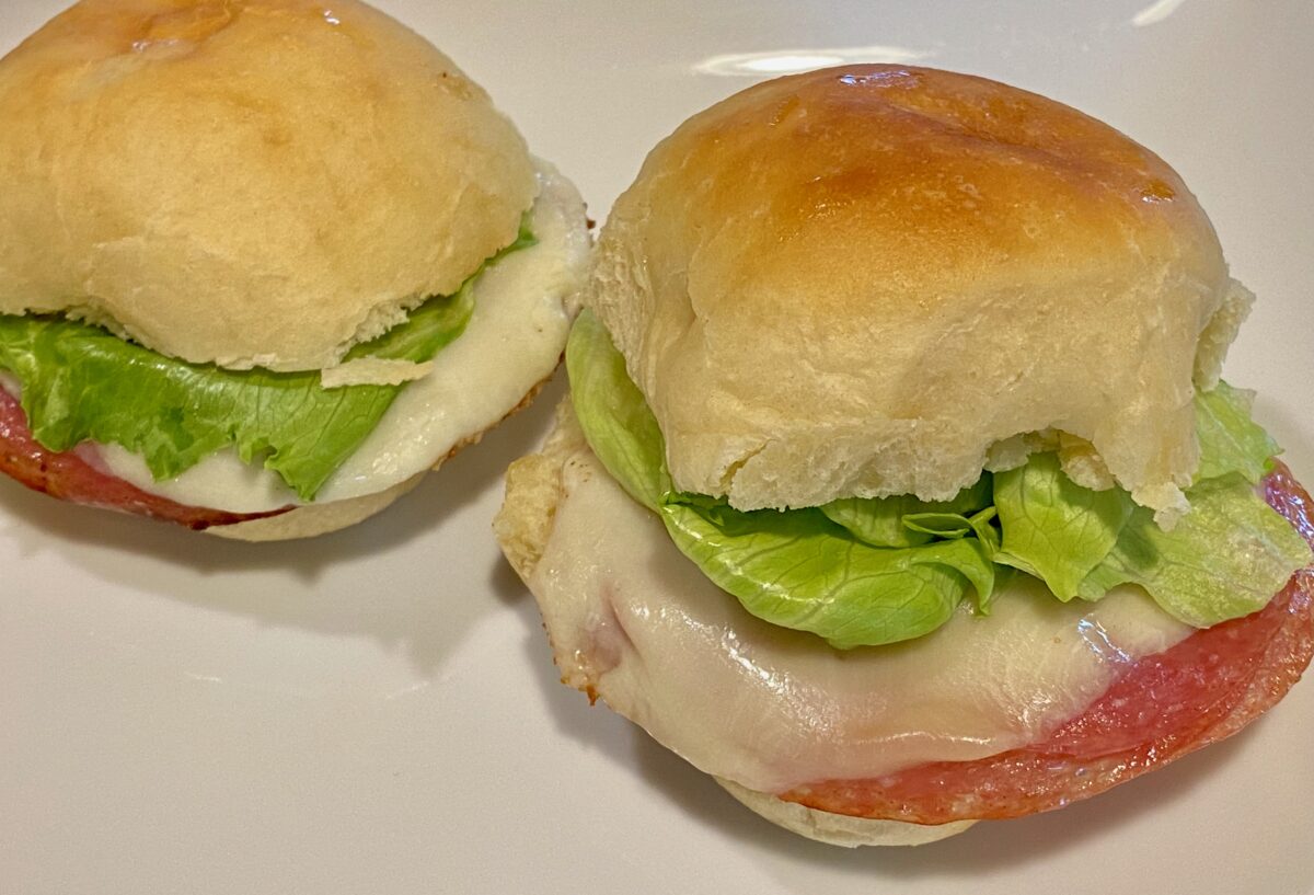 Two lettuce, salami, and provolone sliders made with leftover dinner rolls.