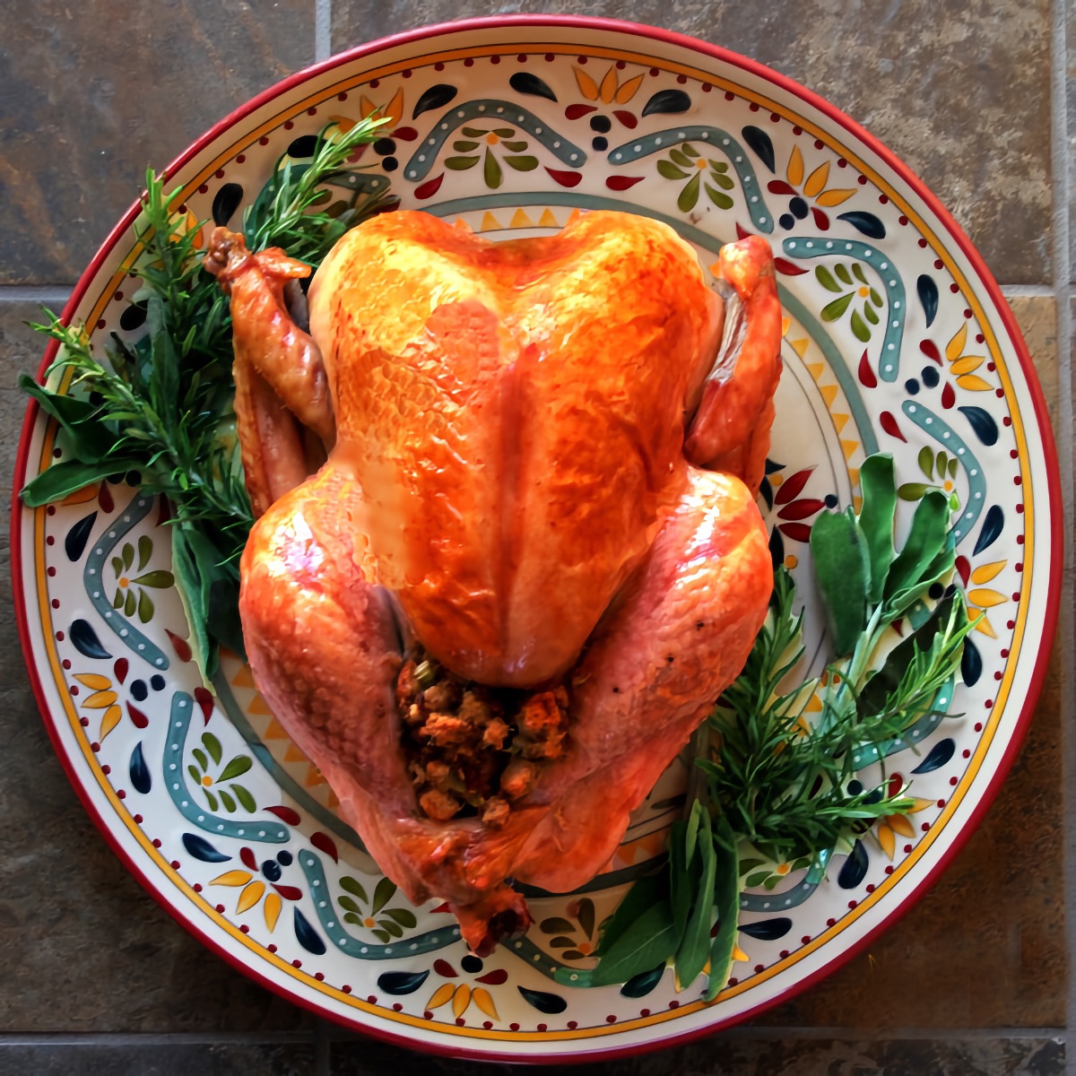 ultimate classic roast turkey on a platter with herbs