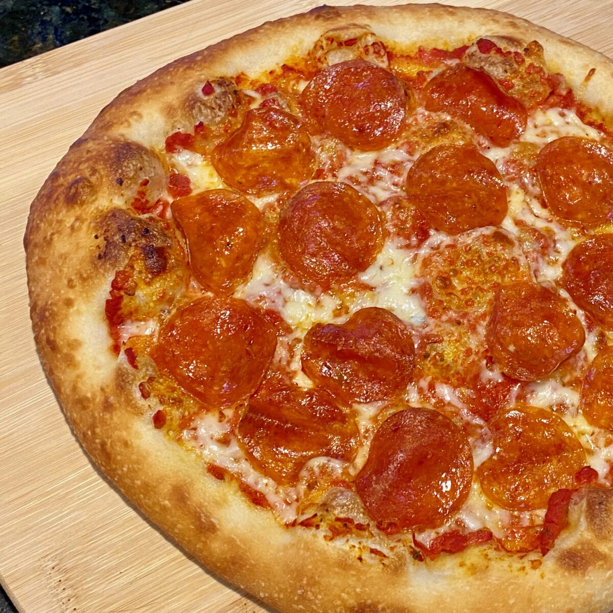 close up view of a pepperoni pizza.