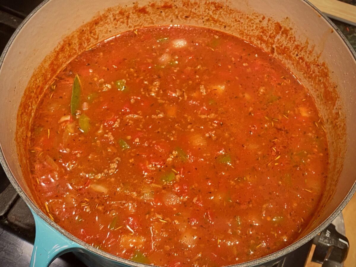 top view of a pot of american goulash before the noodles are added.