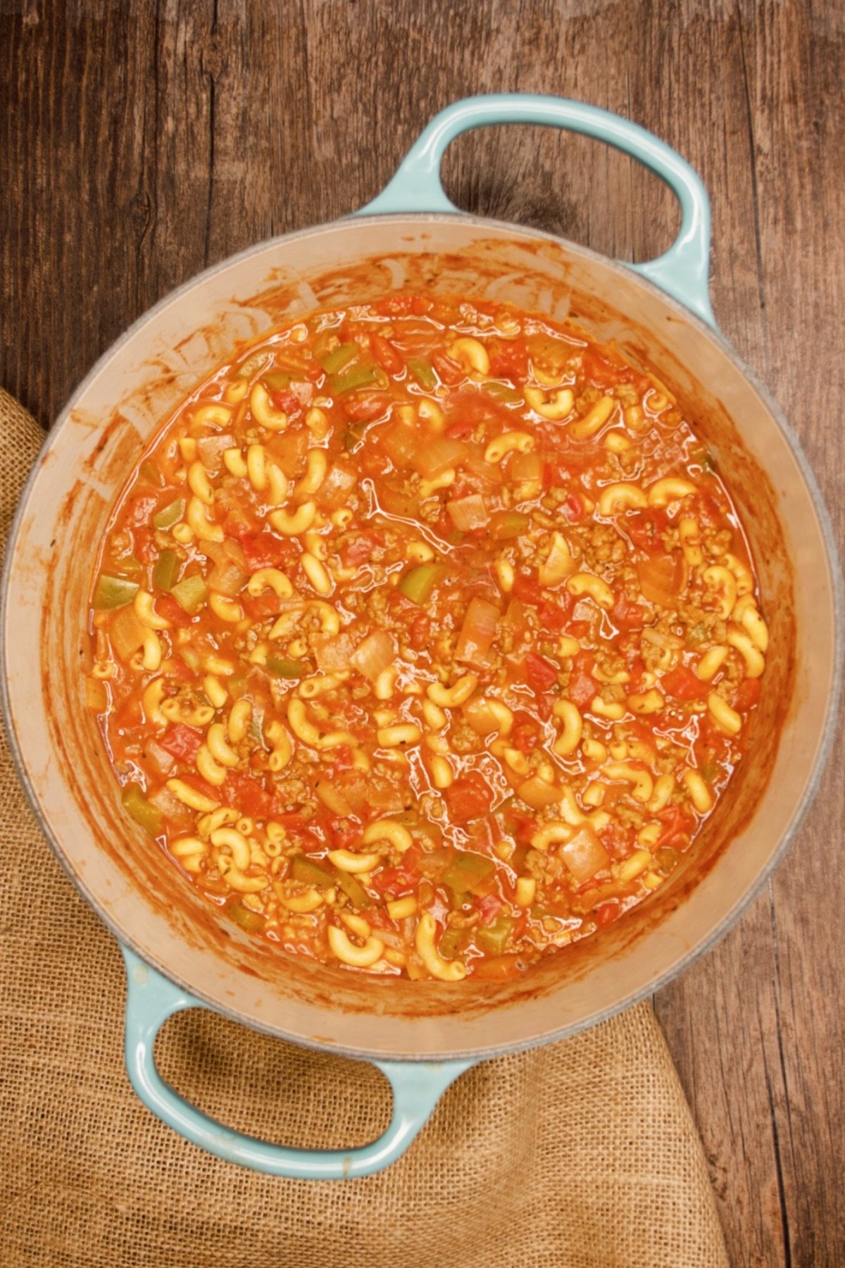 Top view of a pot of american goulash on a table.