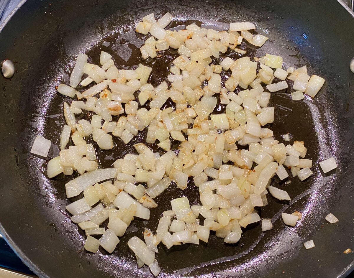 chopped onions sautéing in bacon grease