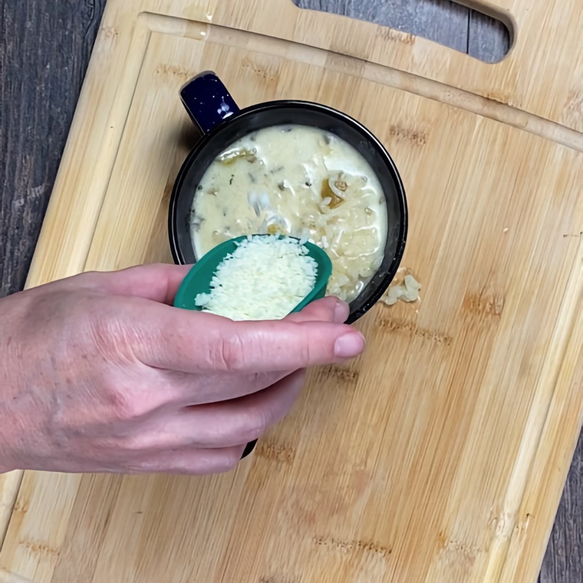 Adding cotija cheese to top the soup right before serving.