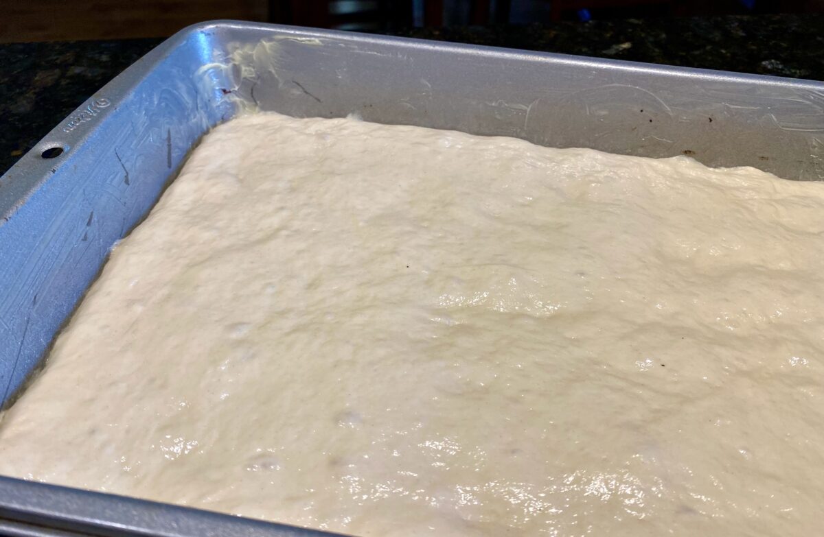 The pizza dough after 2 hours of proofing, ready for toppings.