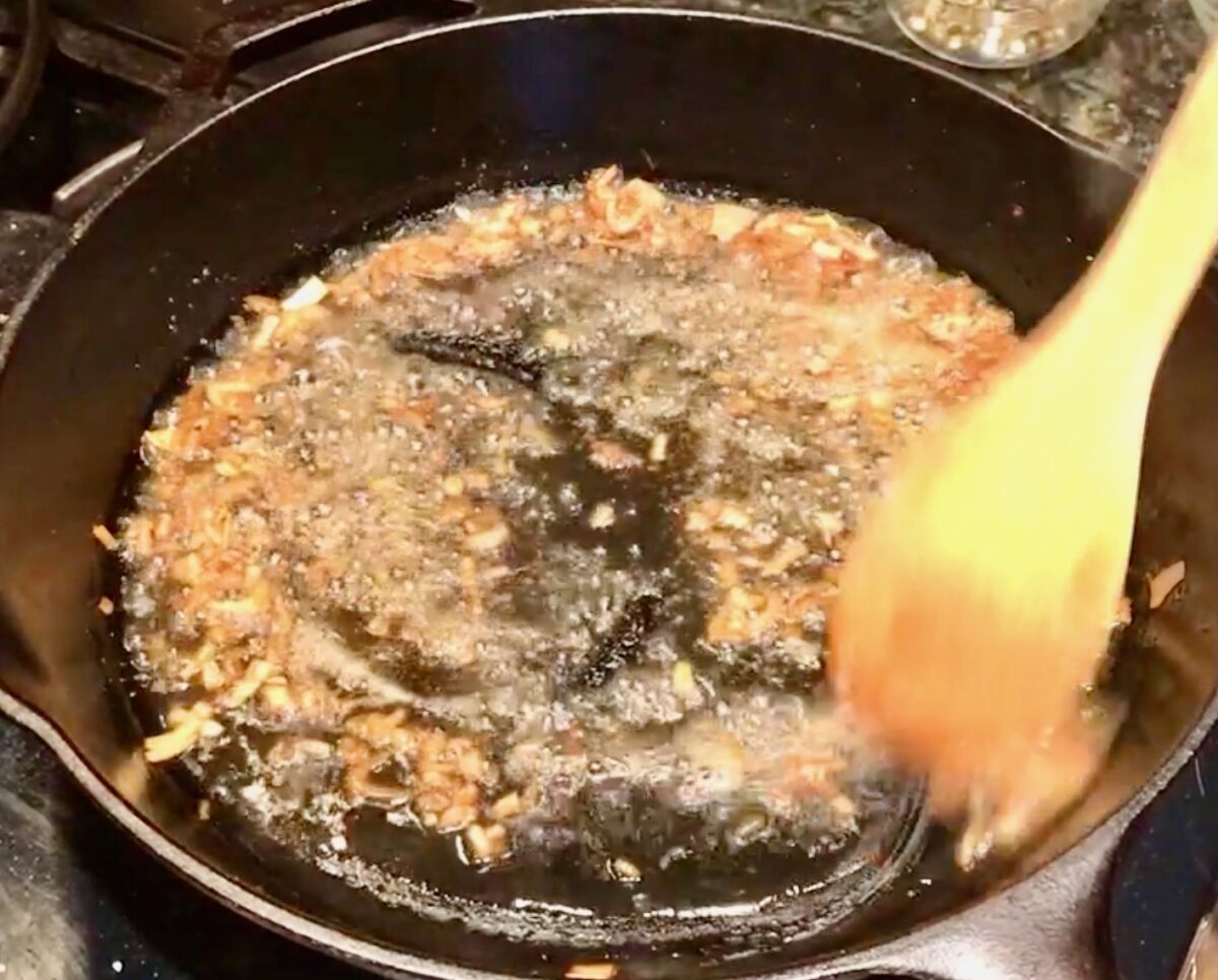 Brandy burning off in hot skillet that has shallots in it.