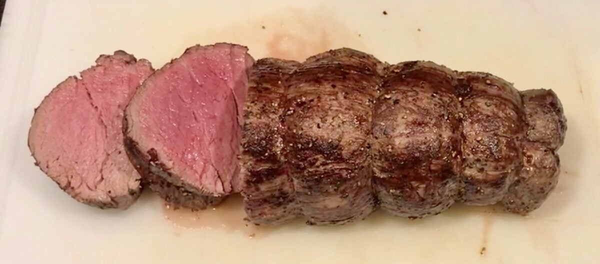 two medium rare slices of tenderloin but from a whole tenderloin.