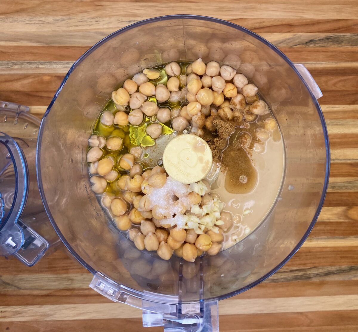 The ingredients for spicy hummus (except for the harissa topping) in the food processor.