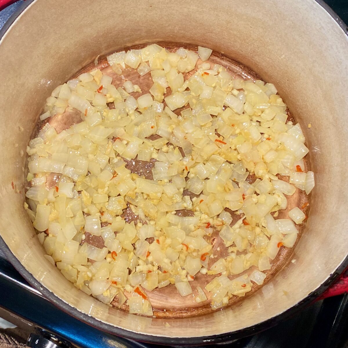 Ginger and garlic sauteing along with the softened onions and Thai chili.