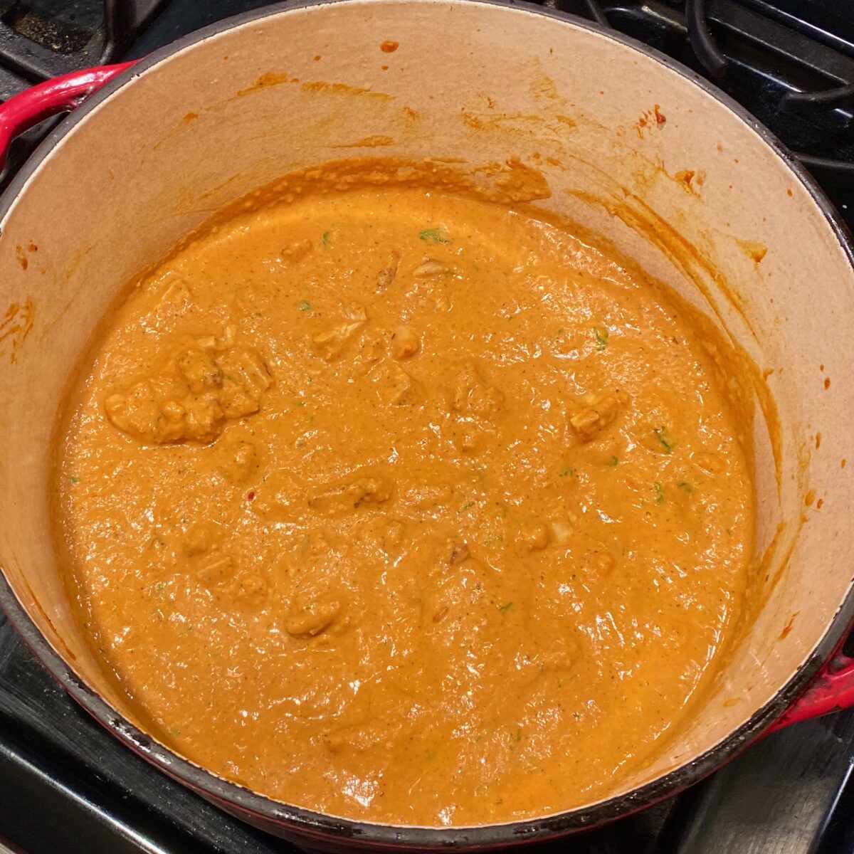 The finished butter chicken simmering just before serving.