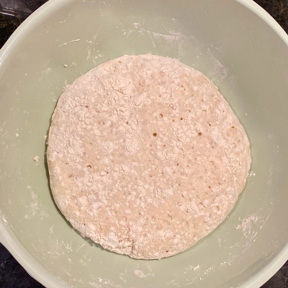 The dough, ready to be dumped from the bowl onto a well-floured work surface.