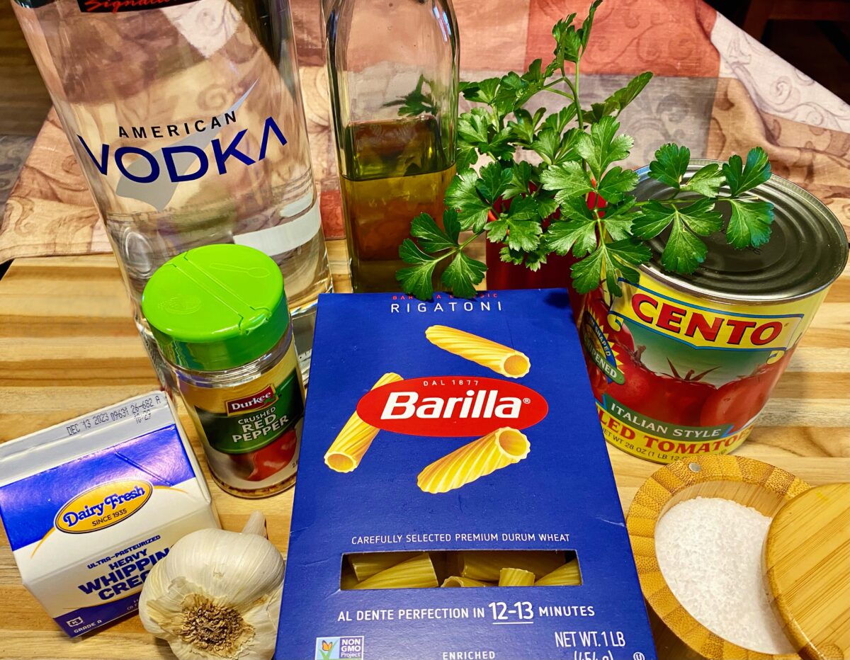Ingredients for pasta alla vodka. Vodka, extra virgin olive oil, parsley, whole peeled tomatoes, salt, pasta, crushed red pepper, garlic, and heavy cream.