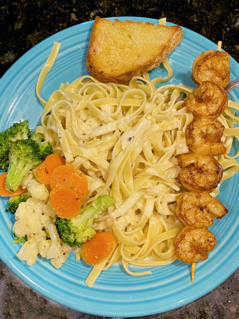 Vegetable Medley with Cajun shrimp, homemade bread, and fettuccine Alfredo.